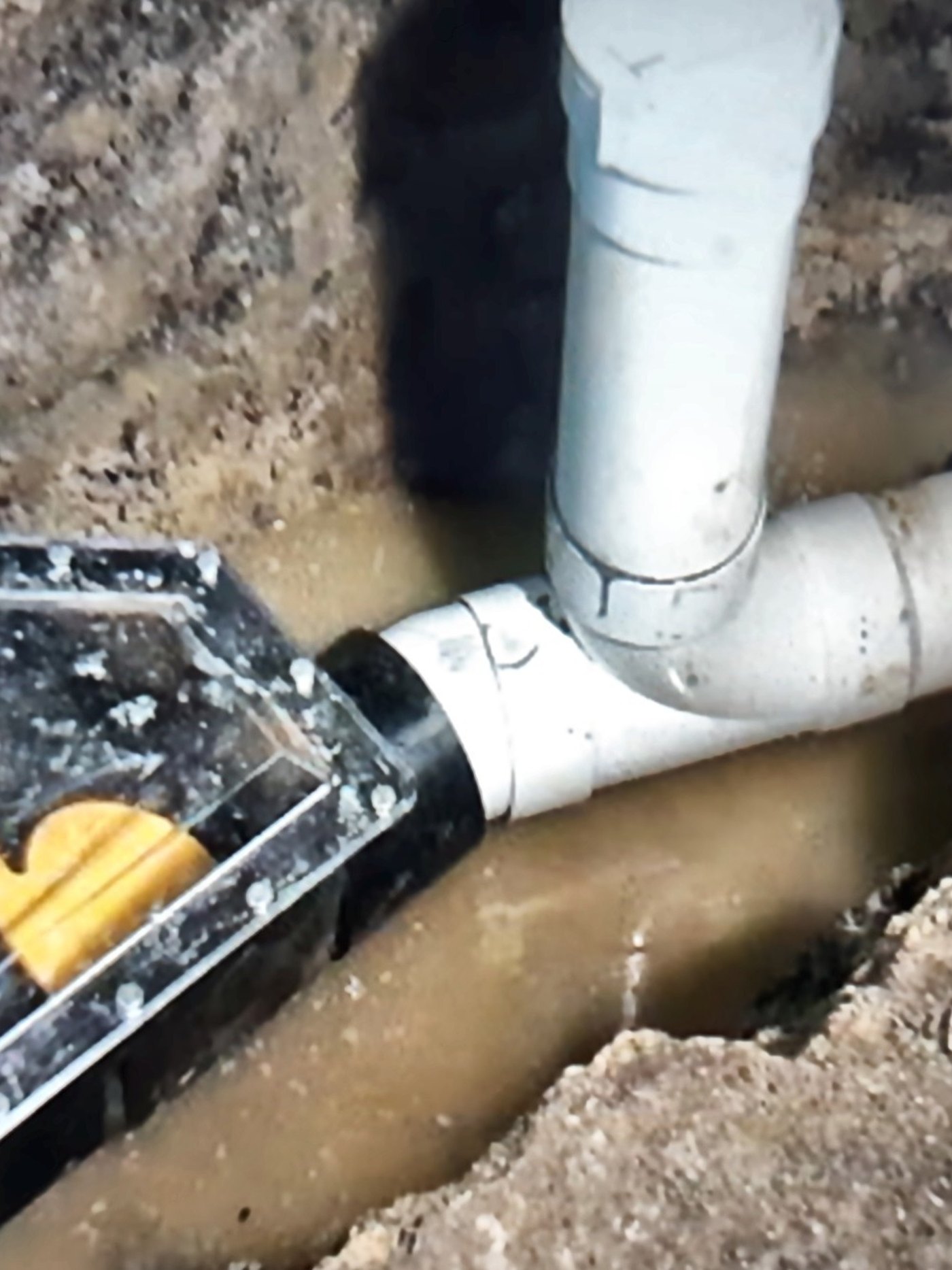 Backwater valve installed on the main drain line in a basement floor