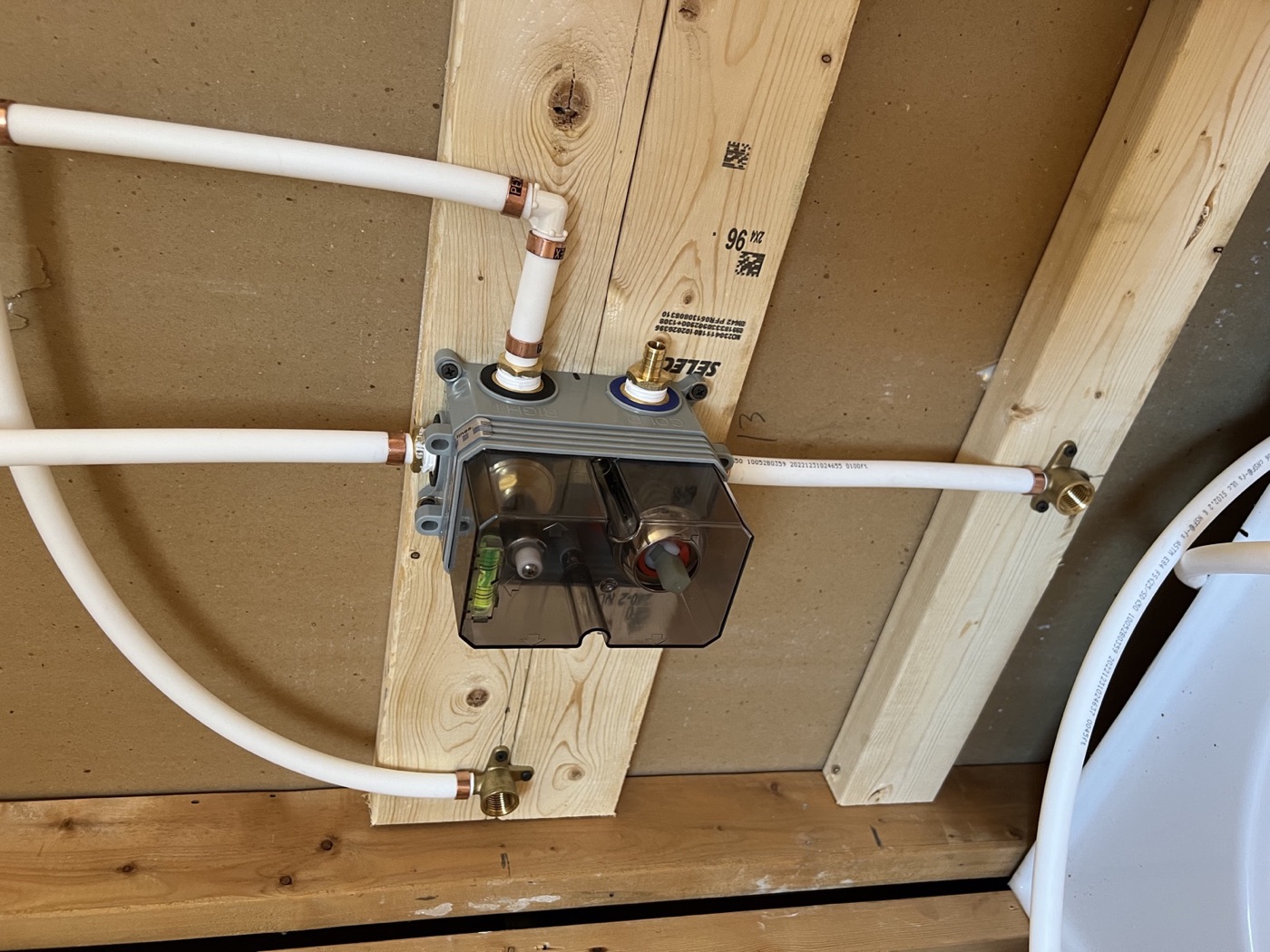 Shower valve rough-in plumbing during a bathroom renovation